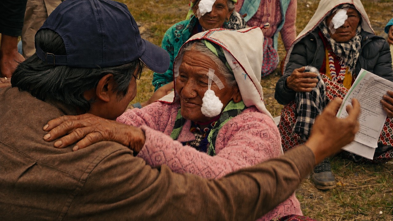 A patient embraces a medical volunteer after treatment